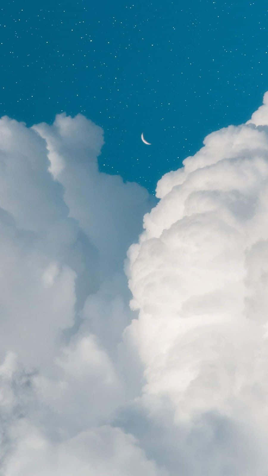 View Of Blue Sky With White Clouds And A Hint Of Green Shrubbery Background