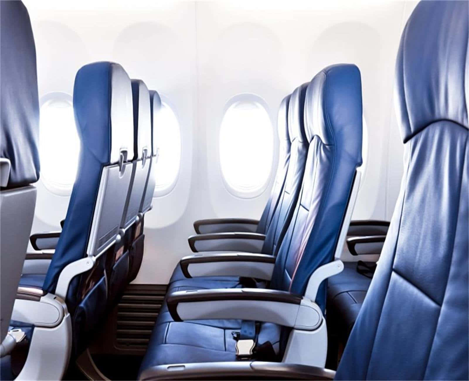 View Of Economy Class Seating Inside An Airplane Background