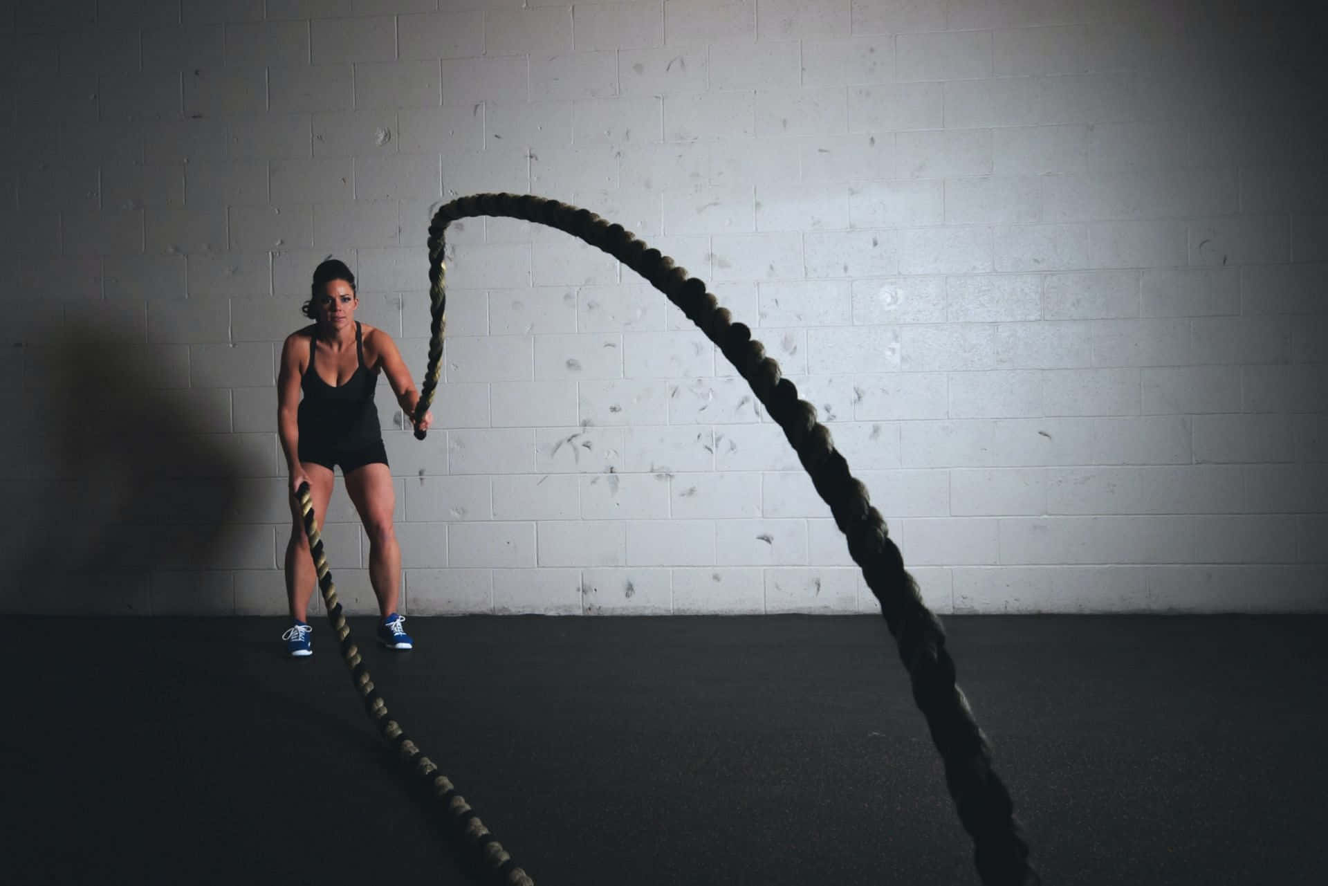 Vigorous Woman Holding Rope Background