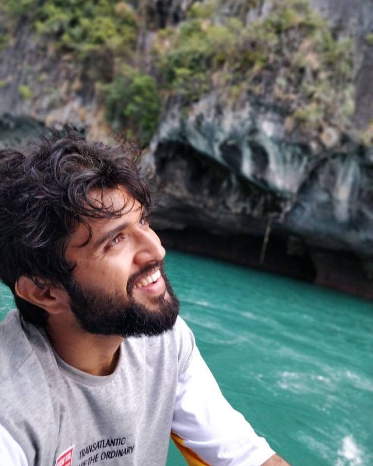 Vijay Deverakonda Smiling On A Beach 4k Background