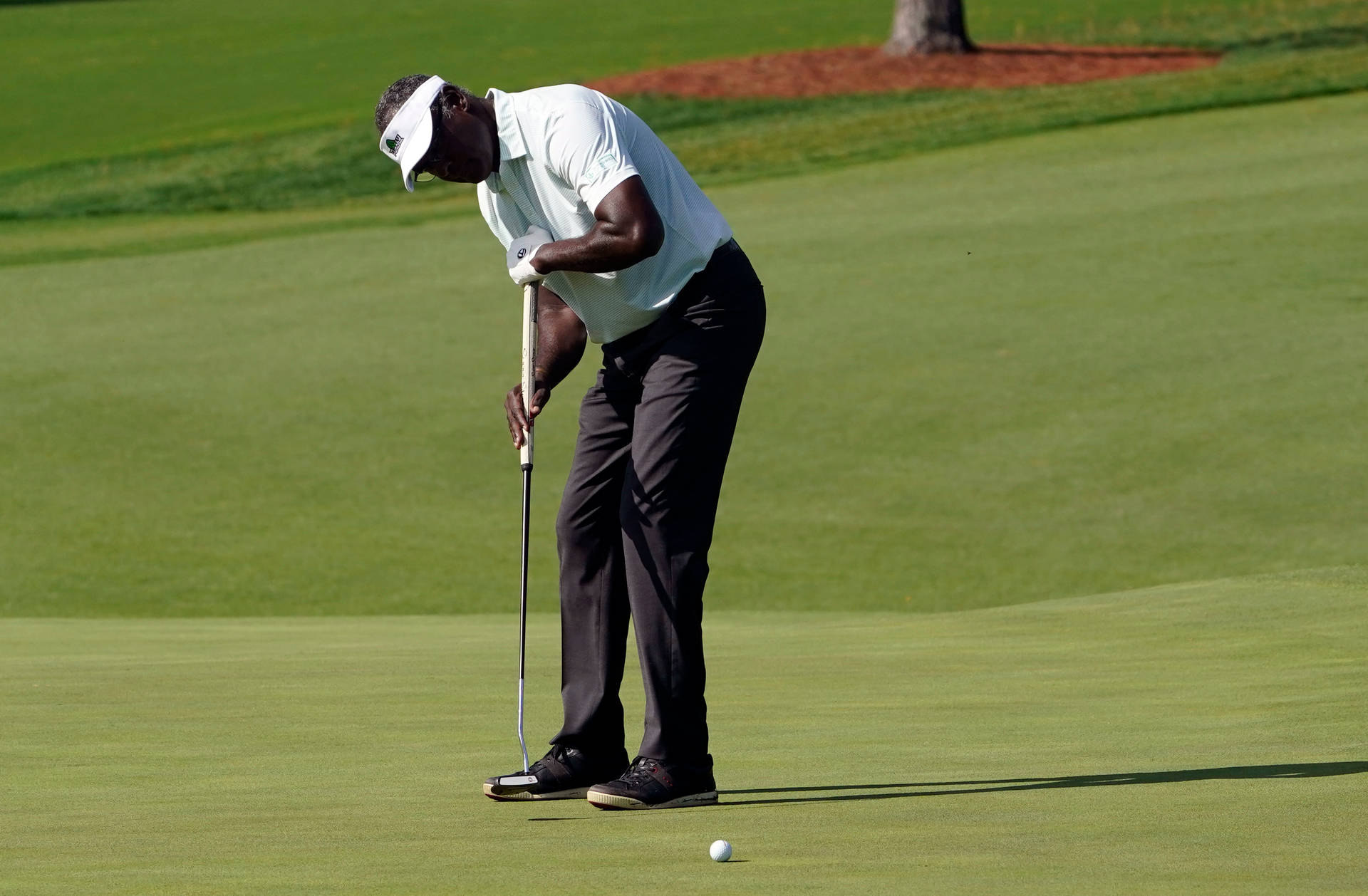 Vijay Singh Checking Golf Ball Background