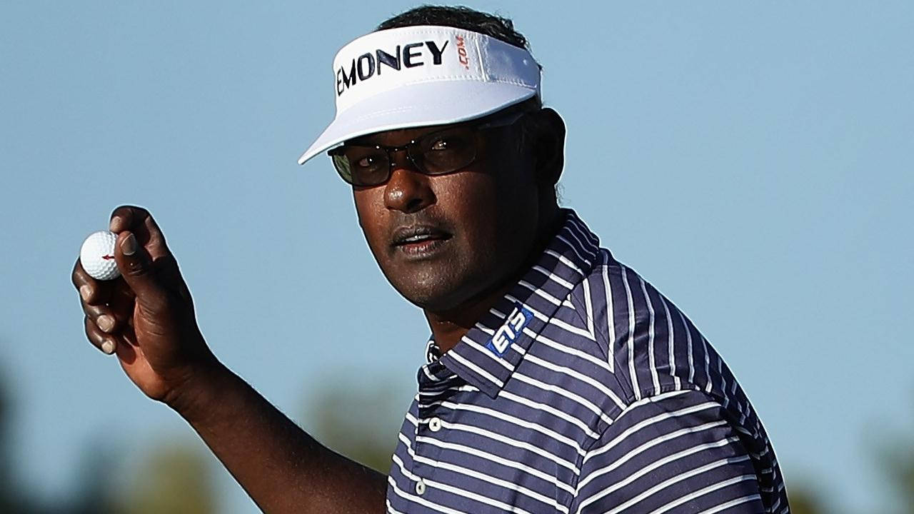 Vijay Singh Holding Golf Ball Background