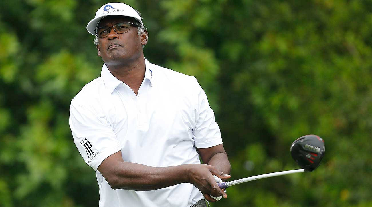 Vijay Singh Holding Out Golf Club Background