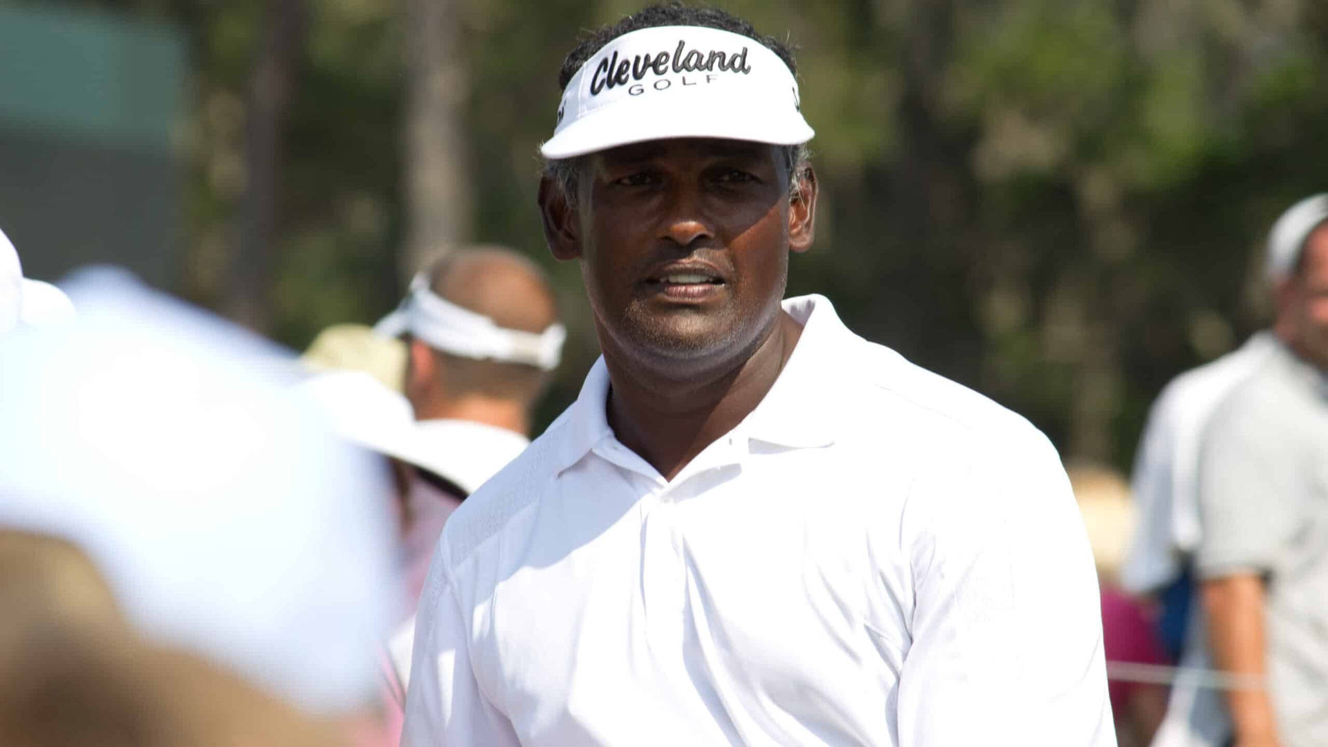 Vijay Singh In Classic White Golf Outfit Background