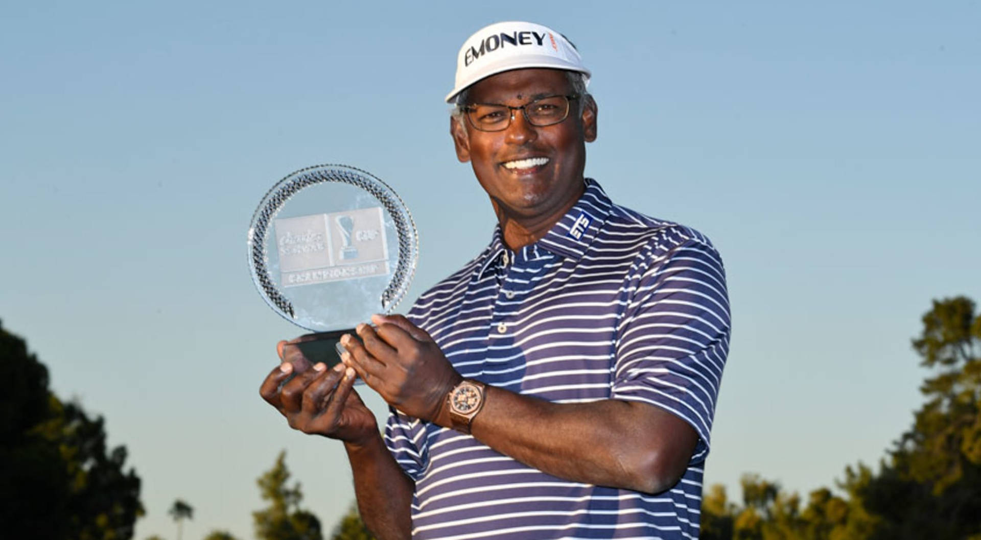 Vijay Singh Smiling And Holding Trophy Background