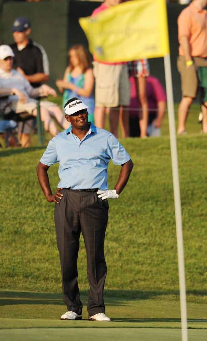 Vijay Singh Standing On Golf Course Background