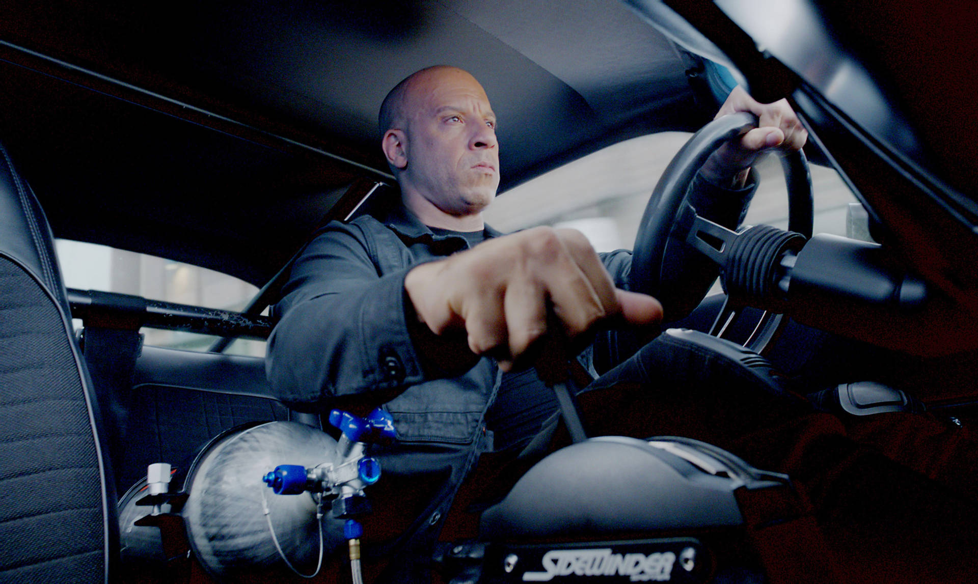 Vin Diesel Driving As Toretto Background