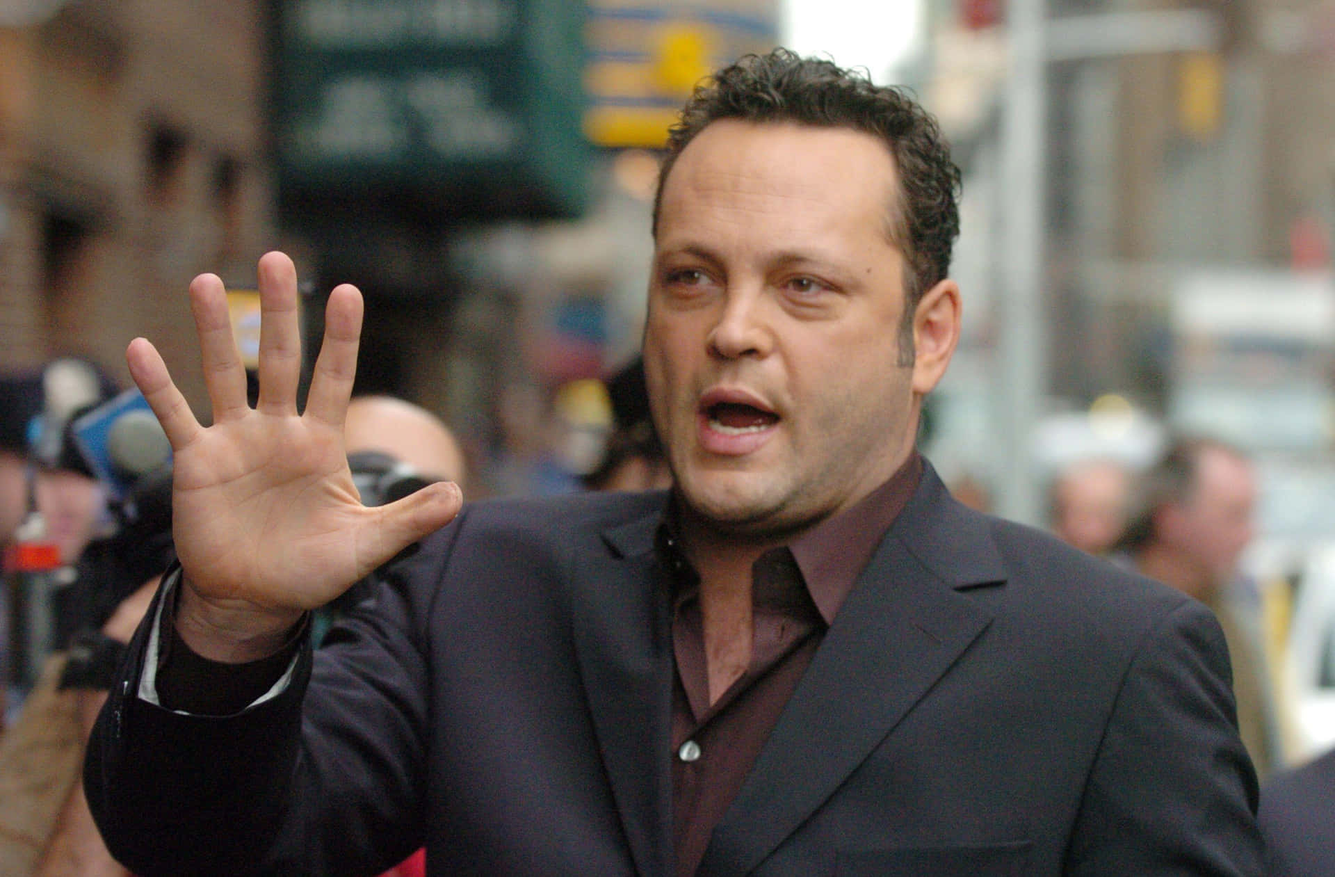 Vince Vaughn Posing In A Stylish Suit Background