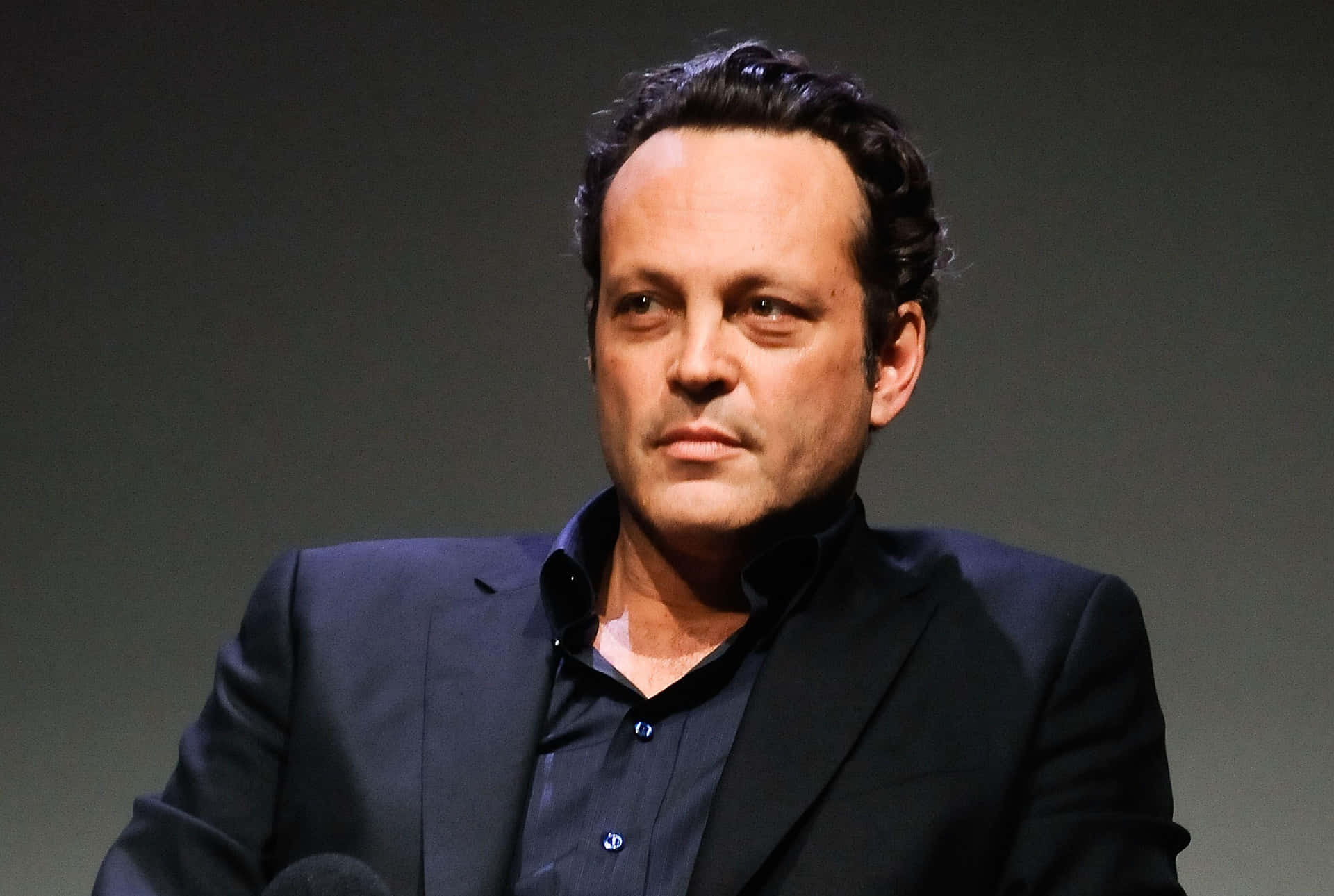 Vince Vaughn Smiling In A Stylish Suit Background
