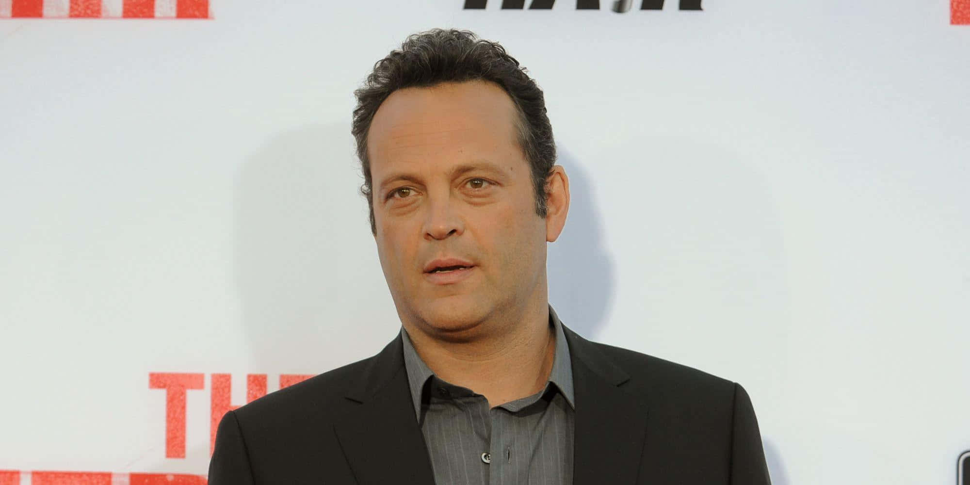 Vince Vaughn Striking A Pose During A Photoshoot Background