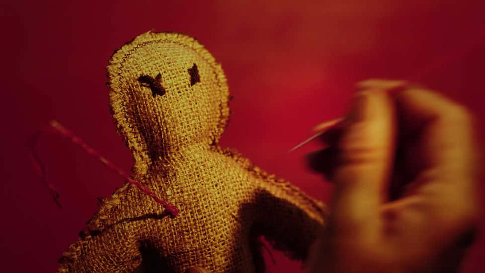 Vindictive Spell On A Voodoo Doll Background