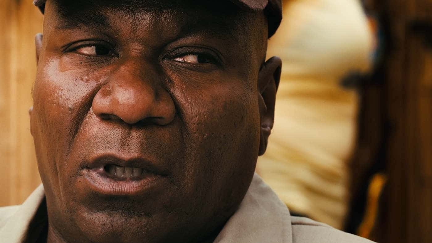 Ving Rhames Striking A Pose In A Sharp Suit Background