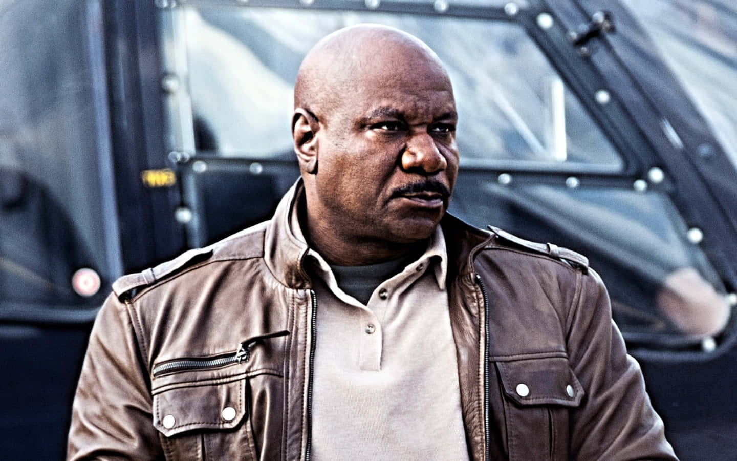 Ving Rhames Striking A Pose In A Stylish Suit Background
