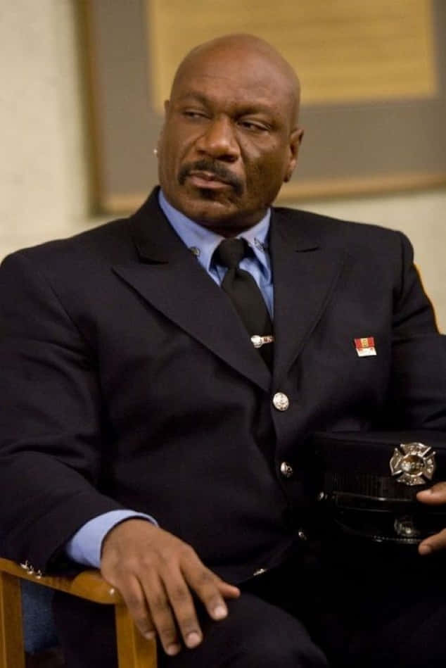 Ving Rhames Striking A Pose In A Stylish Suit Background