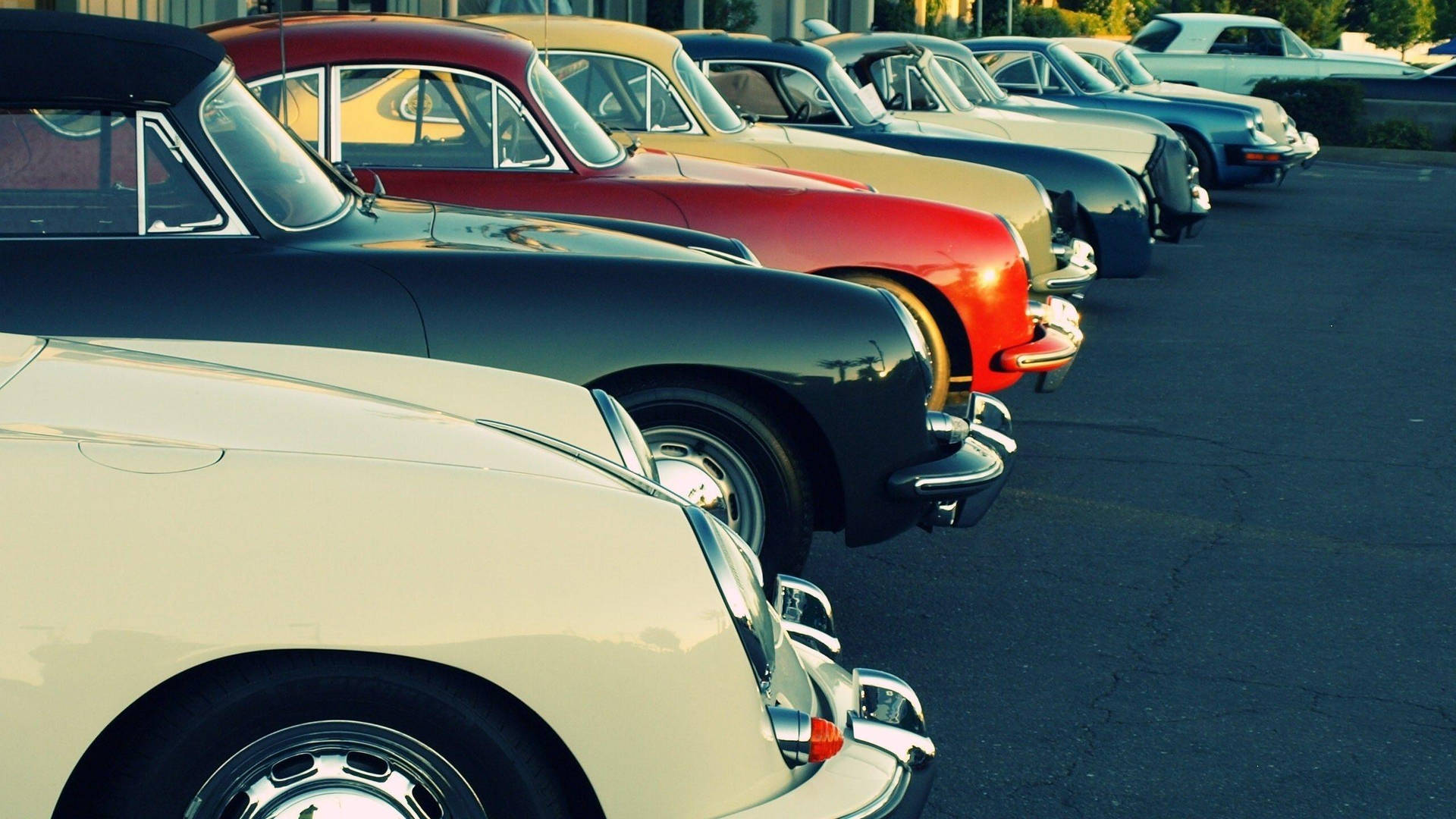 Vintage Beauty Parked: An Old Car In The Lot Background