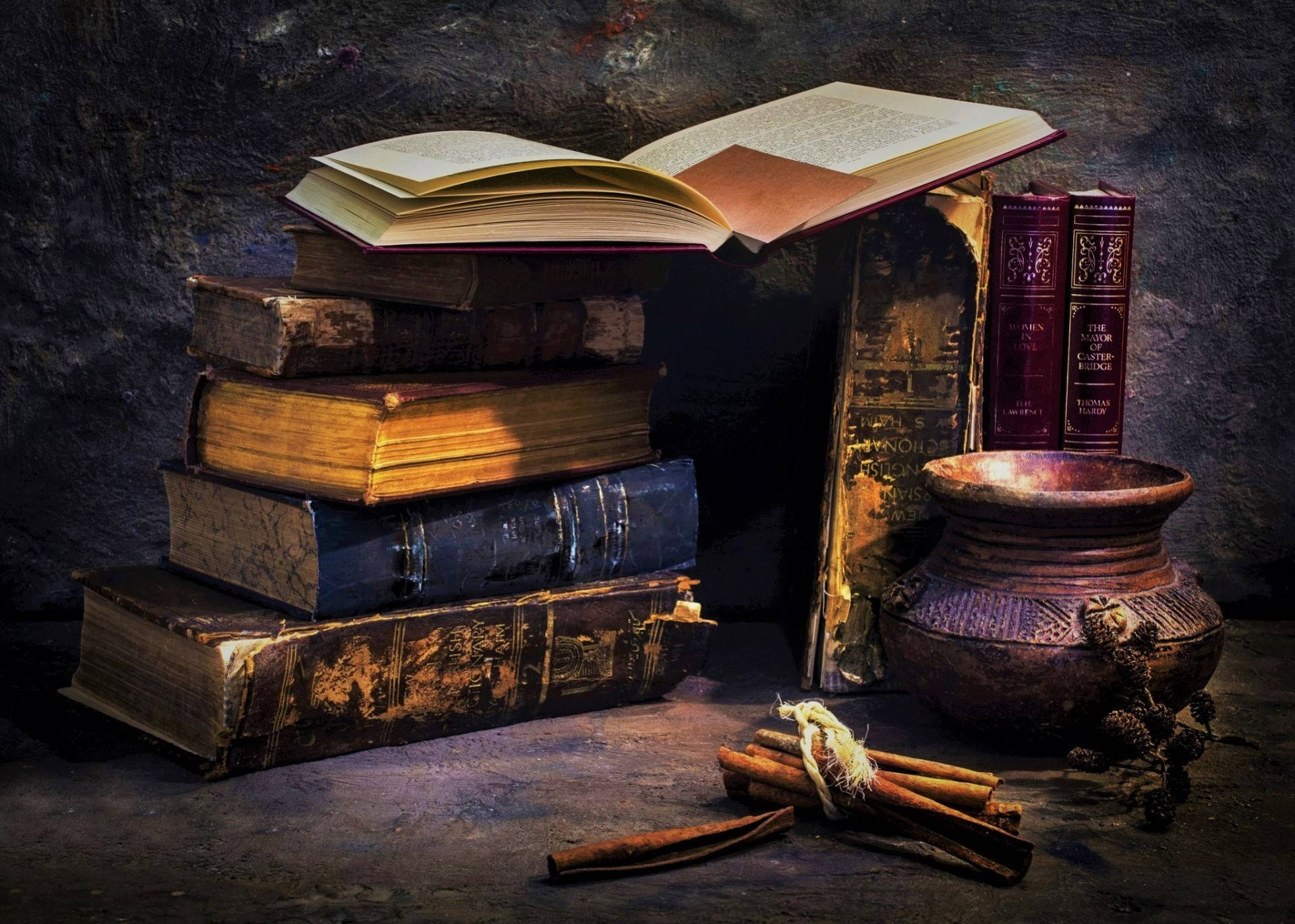 Vintage Bowl Accompanied By Aged Books Background