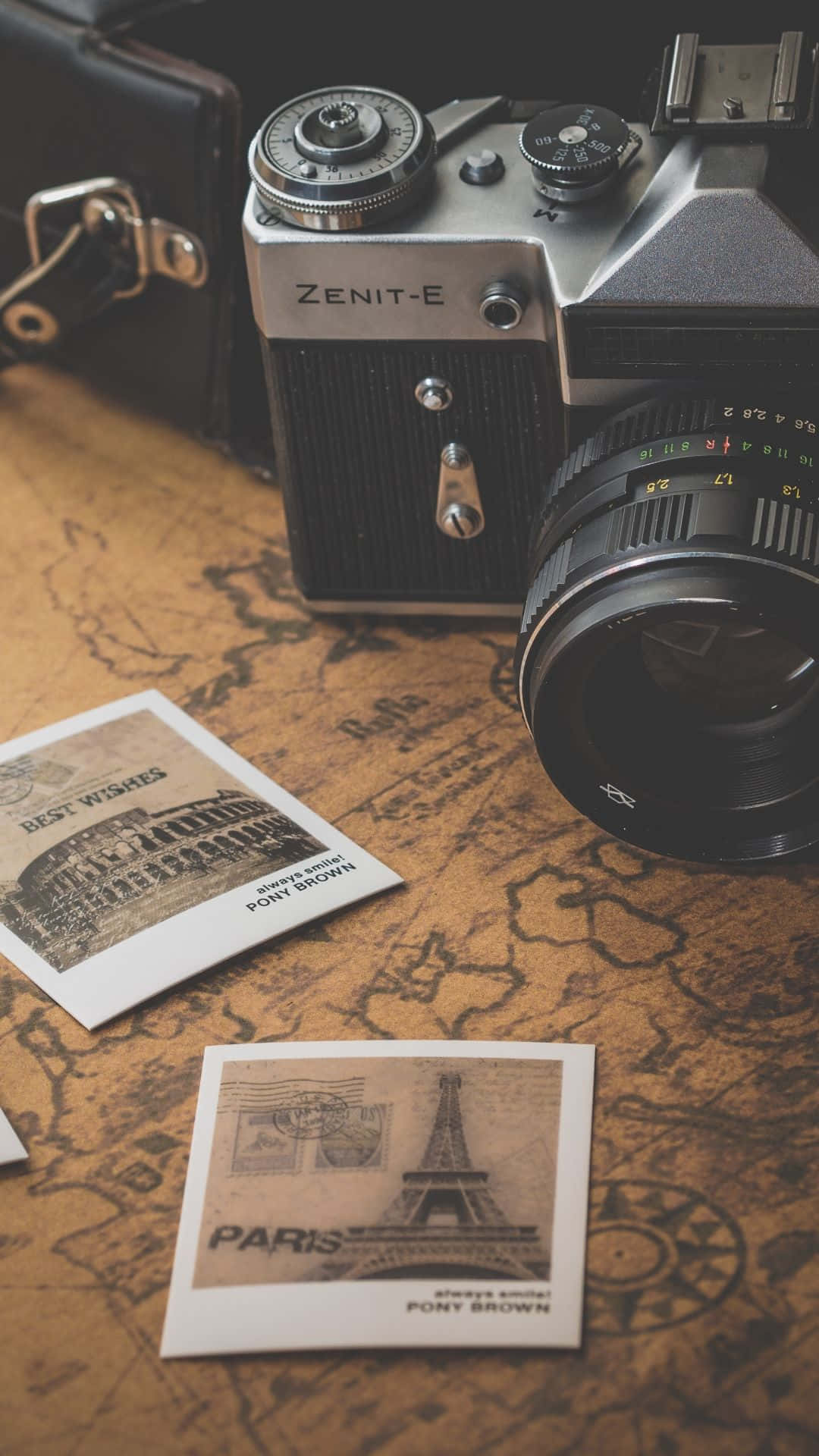 Vintage Camera And A Map On A Table