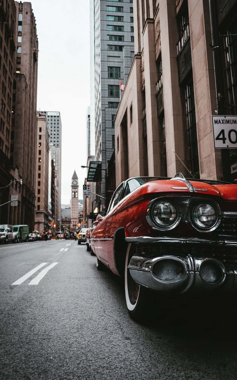 Vintage Car In Metropolis Background