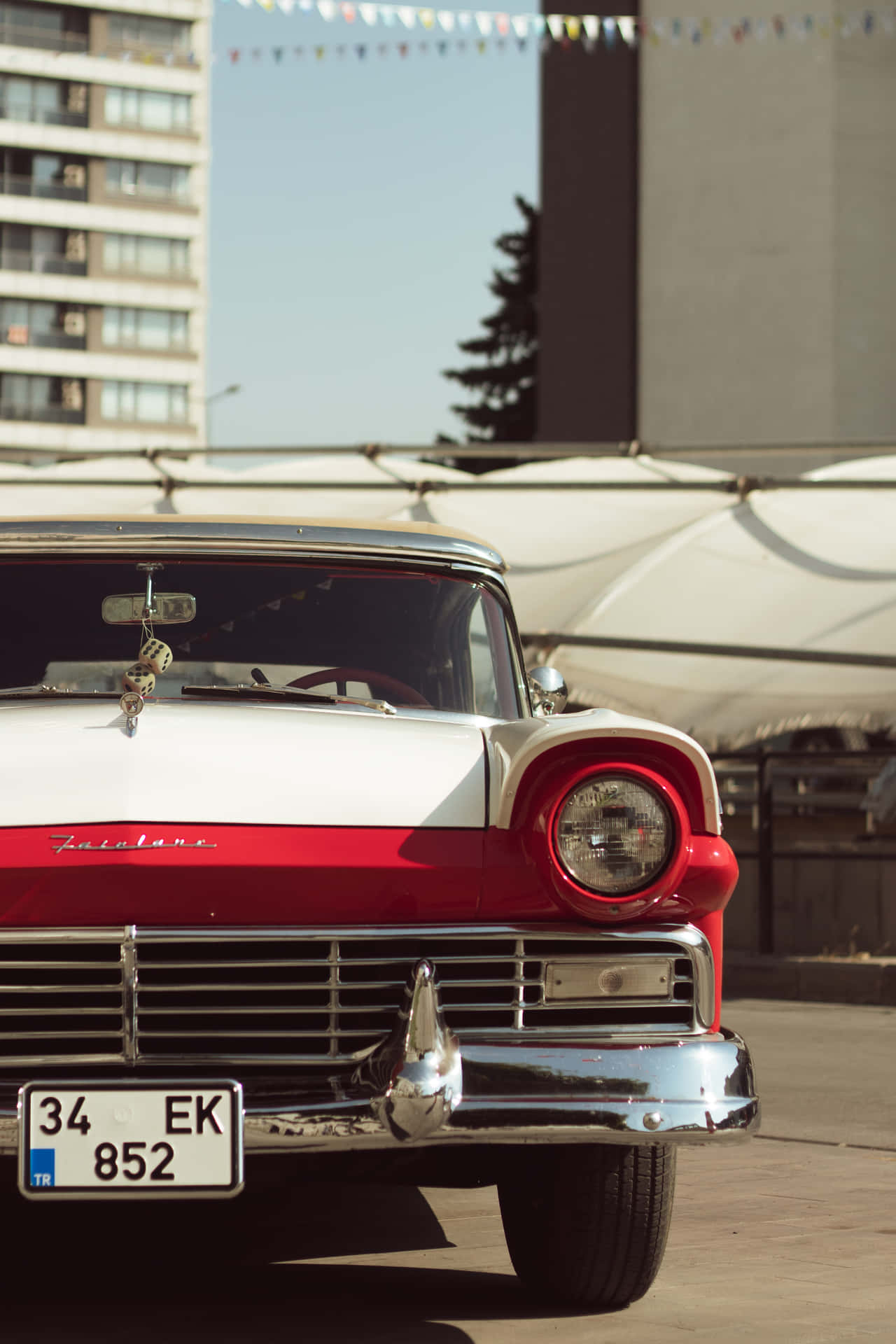 Vintage Car Near Buildings Iphone Background