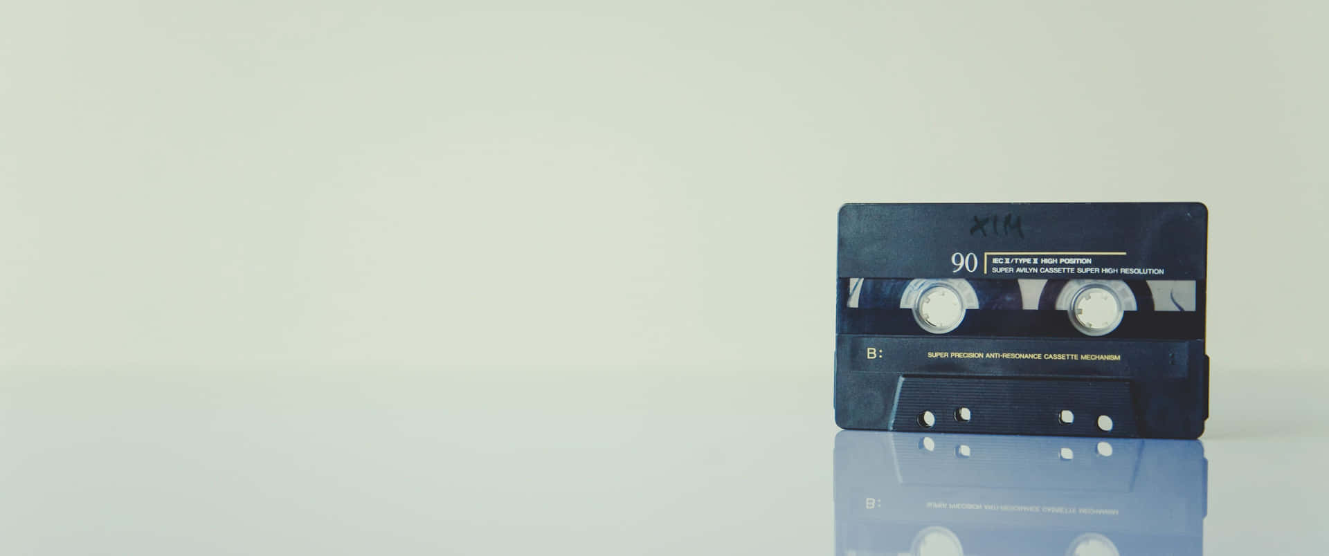 Vintage Cassette Tapeon Reflective Surface Background