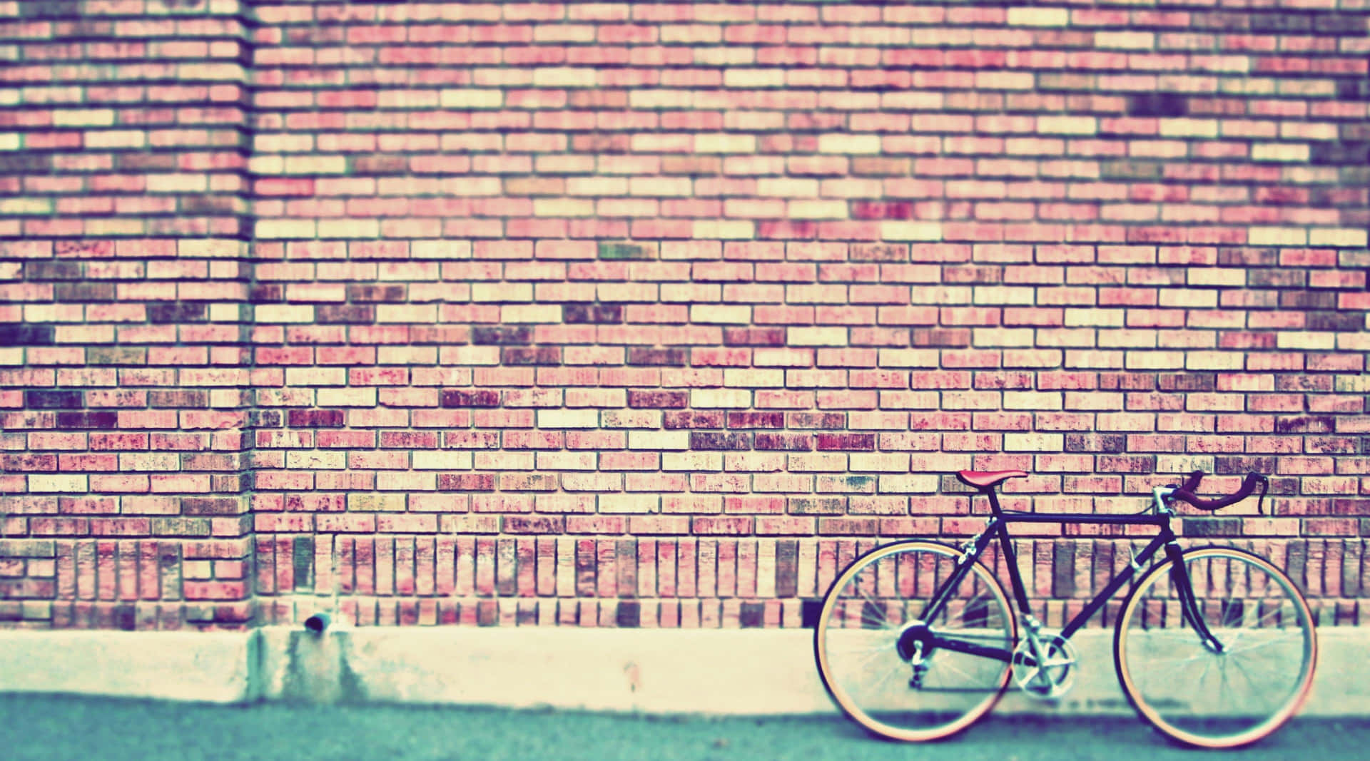 Vintage Desktop Bicycle On Brick Wall Background