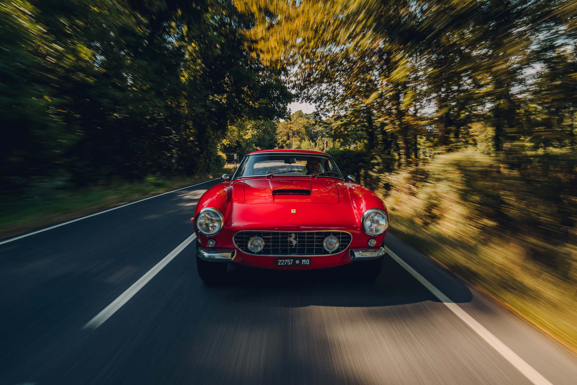 Vintage Ferrari In Motion Background