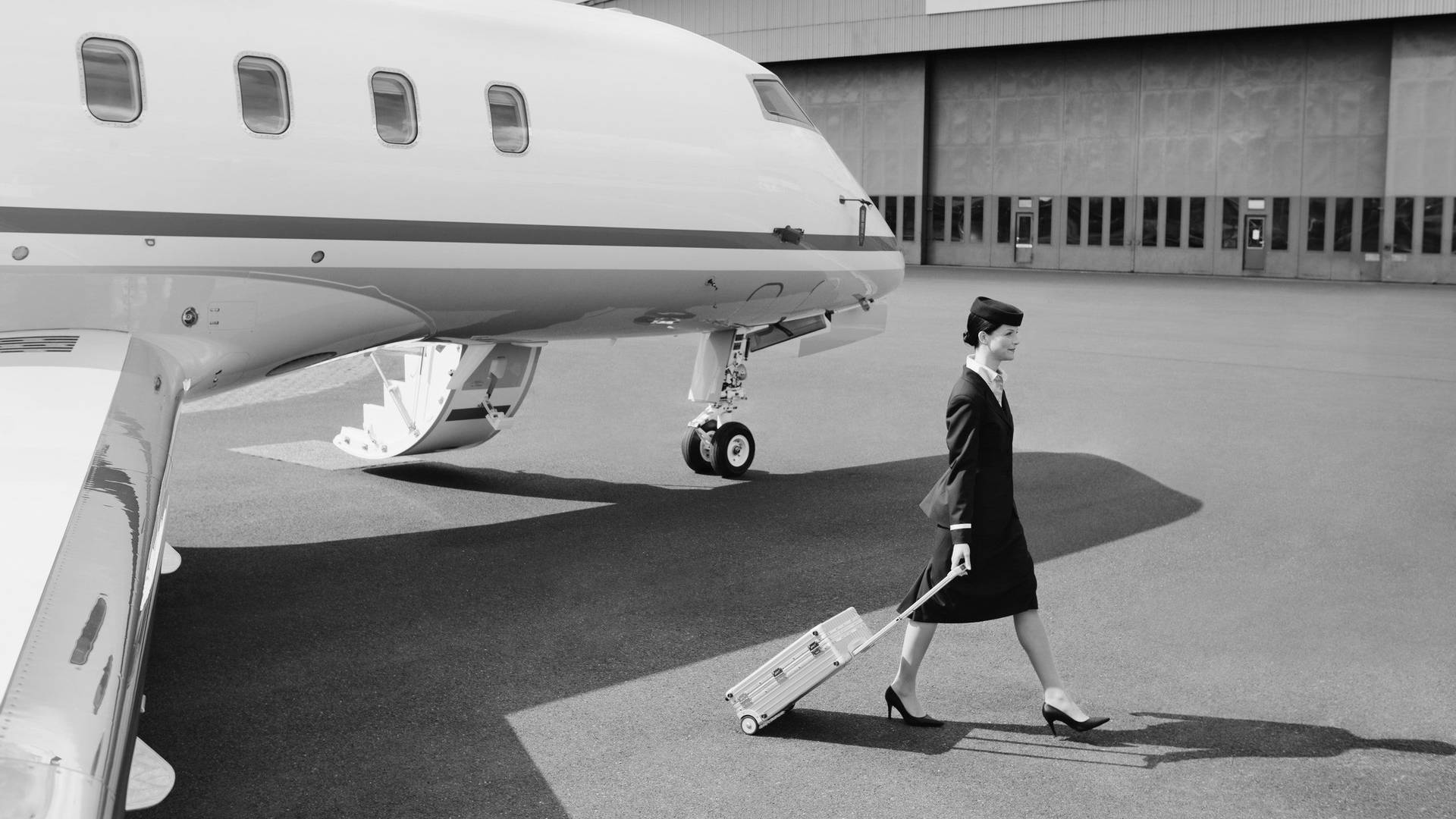 Vintage Flight Attendant In Front Of Airplane Background