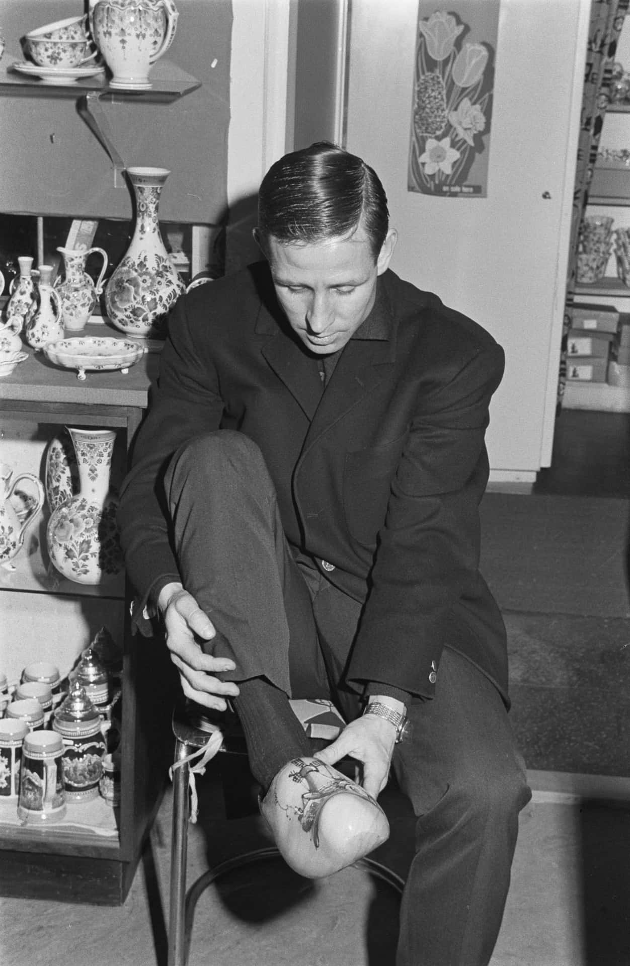 Vintage Footballer Tying Shoes Background