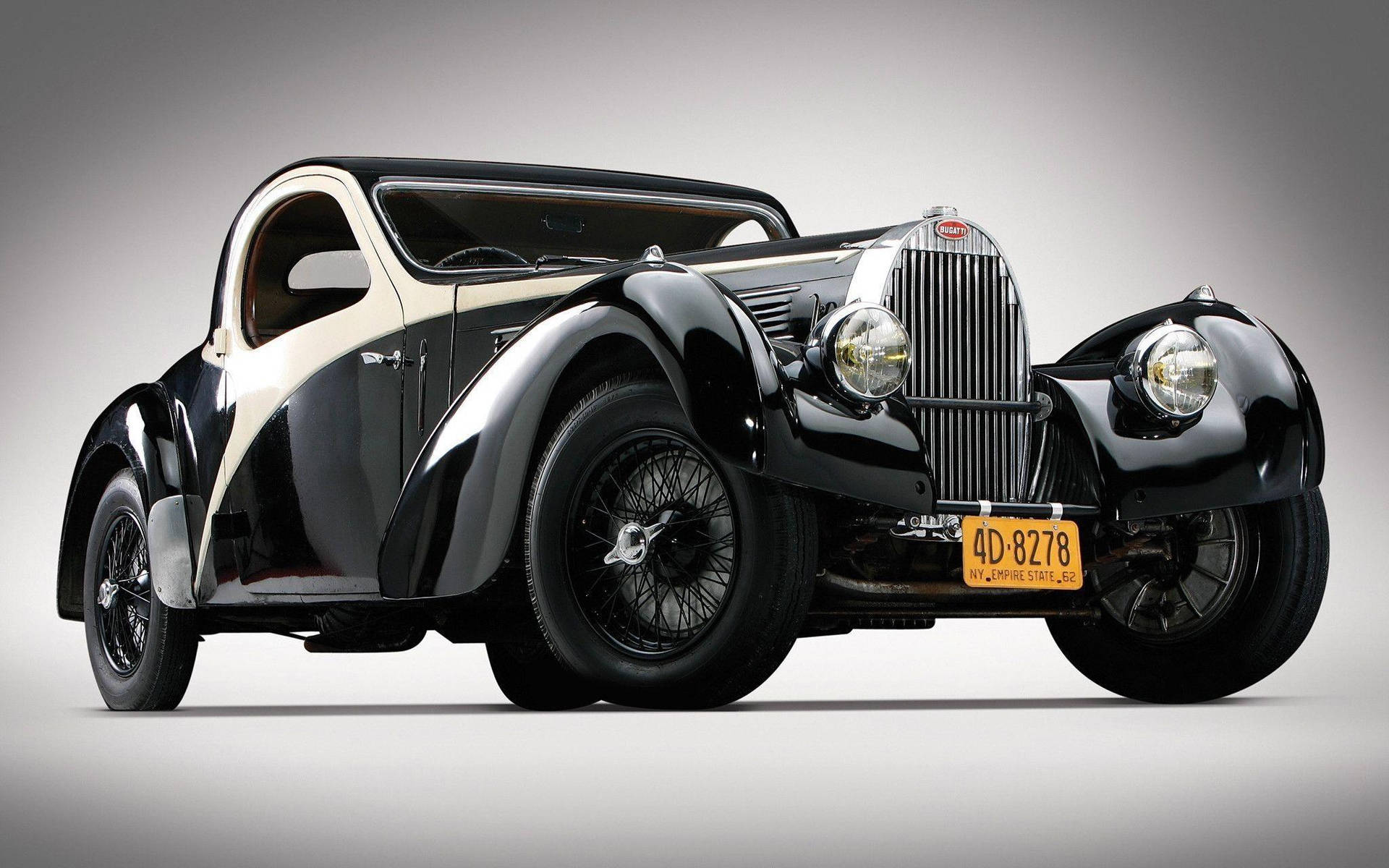 Vintage Grand Tourer: Witness The Timeless Charm Background