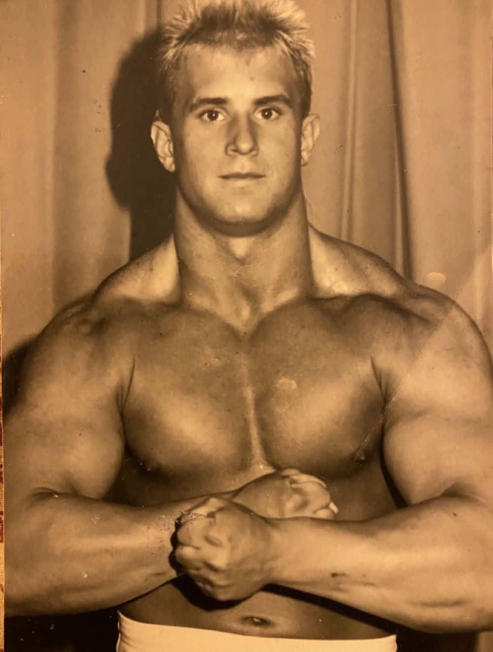 Vintage Muscular Man Posing Sepia Tone Background