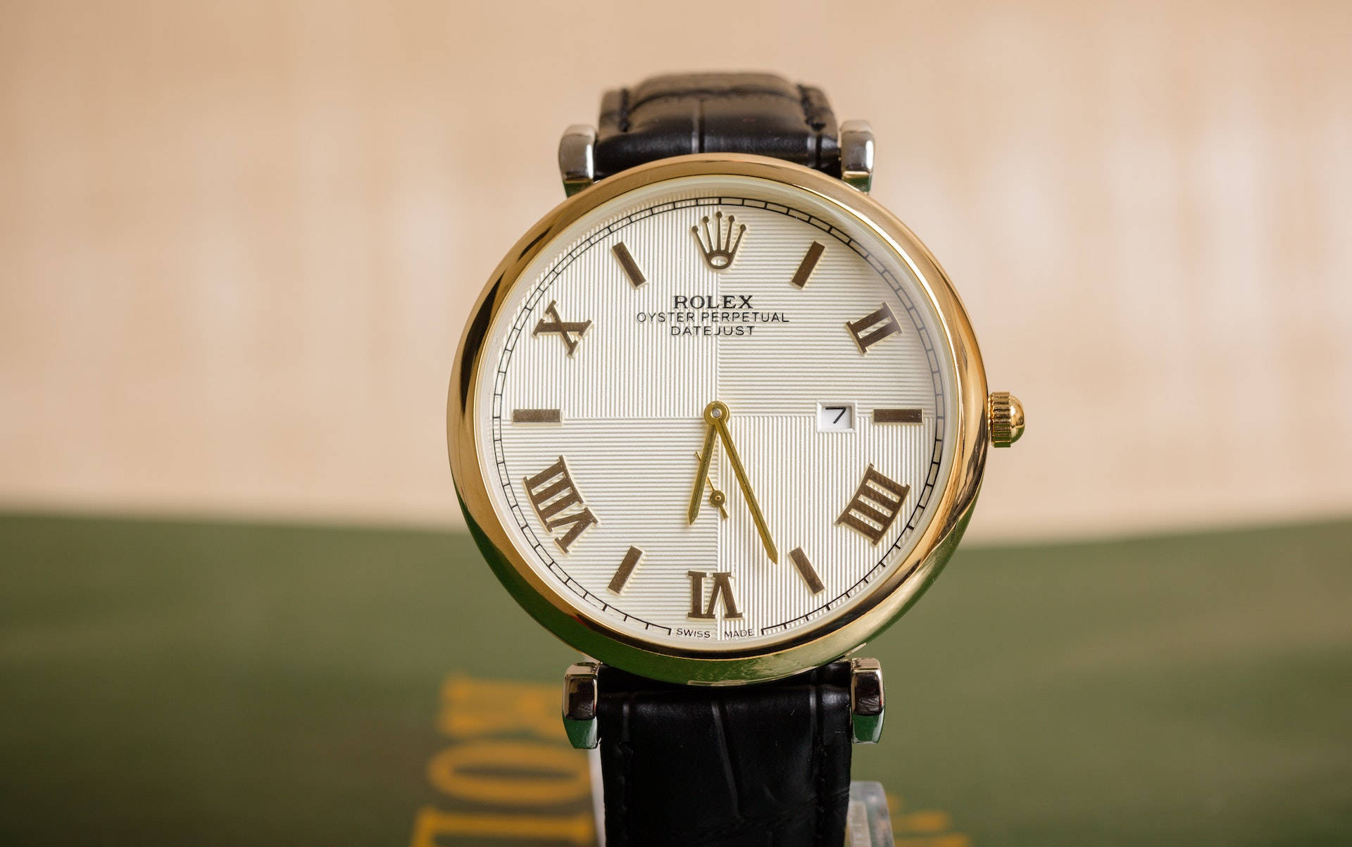 Vintage Rolex Wristwatch With Earth’s Globe: Timeless Luxury Background