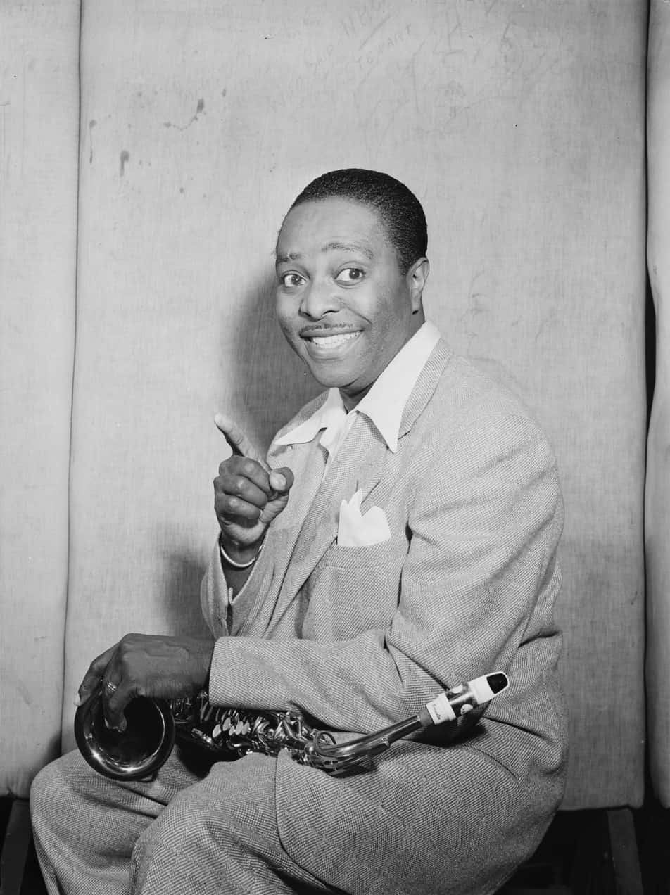 Vintage Saxophonist Pointing Gesture Background