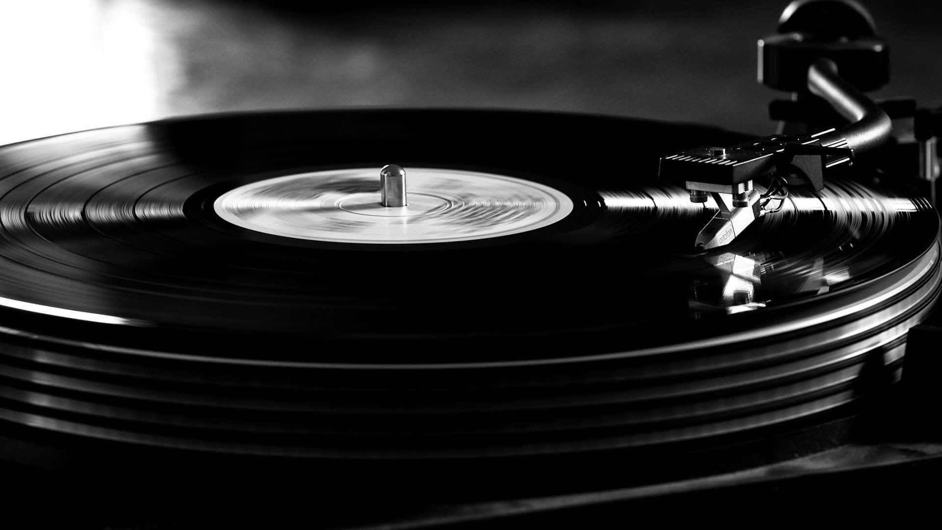 Vinyl Record Being Played On A Turntable Background