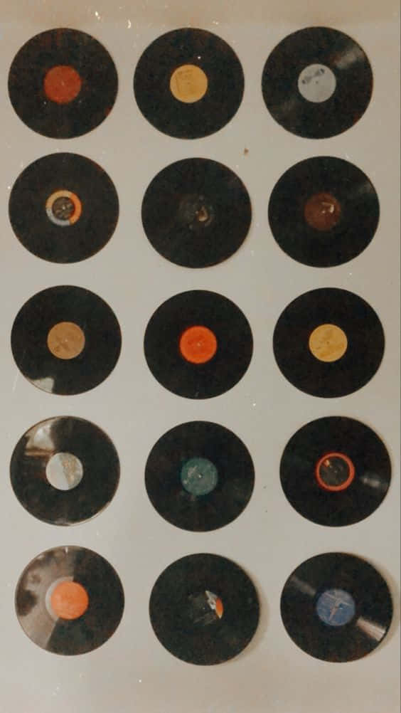 Vinyl Record Collection On A Wall Background