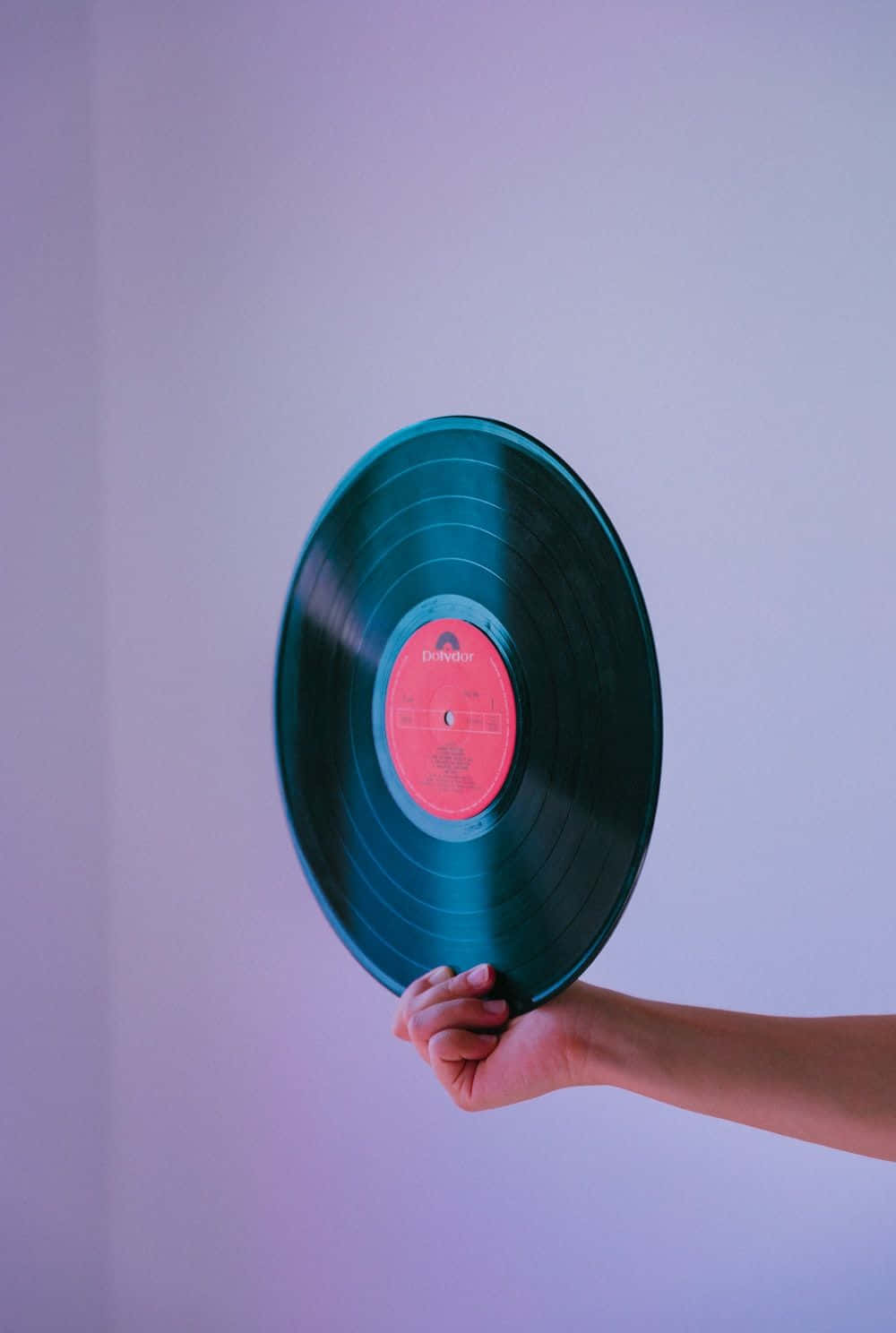 Vinyl Record Held By Hand Background