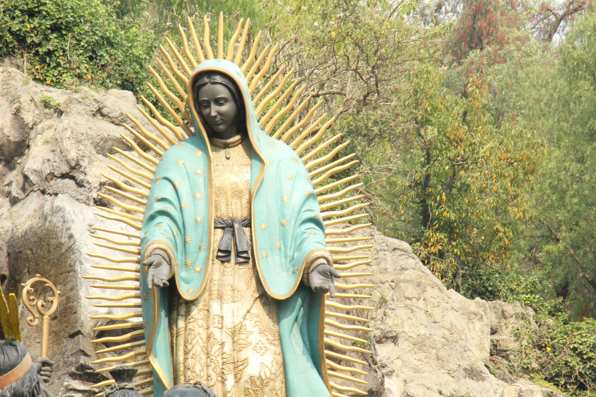 Virgen De Guadalupe Statue In Nature Background