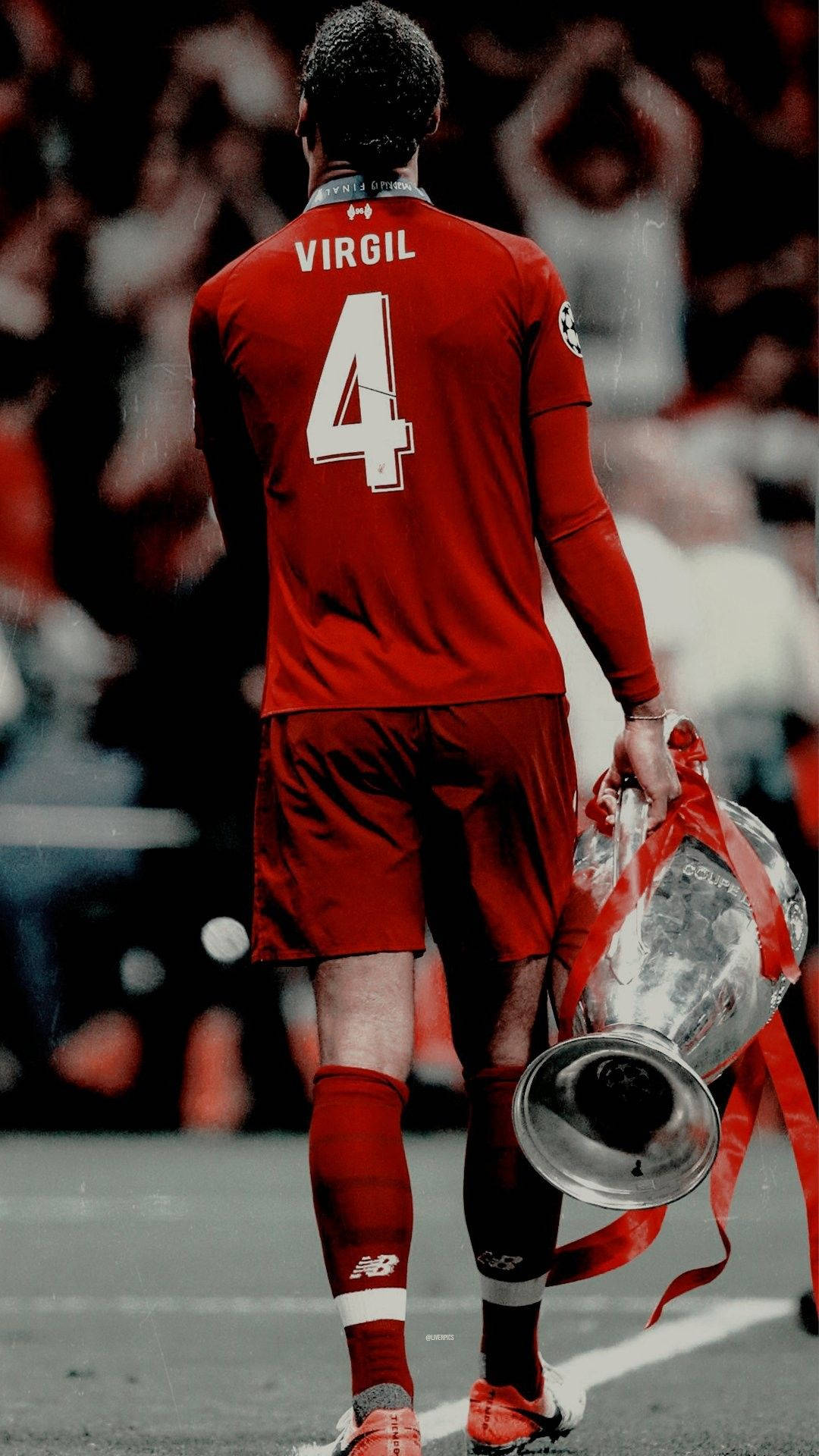 Virgil Van Dijk With The Championship Cup Background