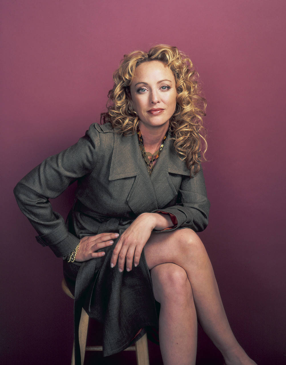 Virginia Madsen Looking Elegant In Grey Coat Background