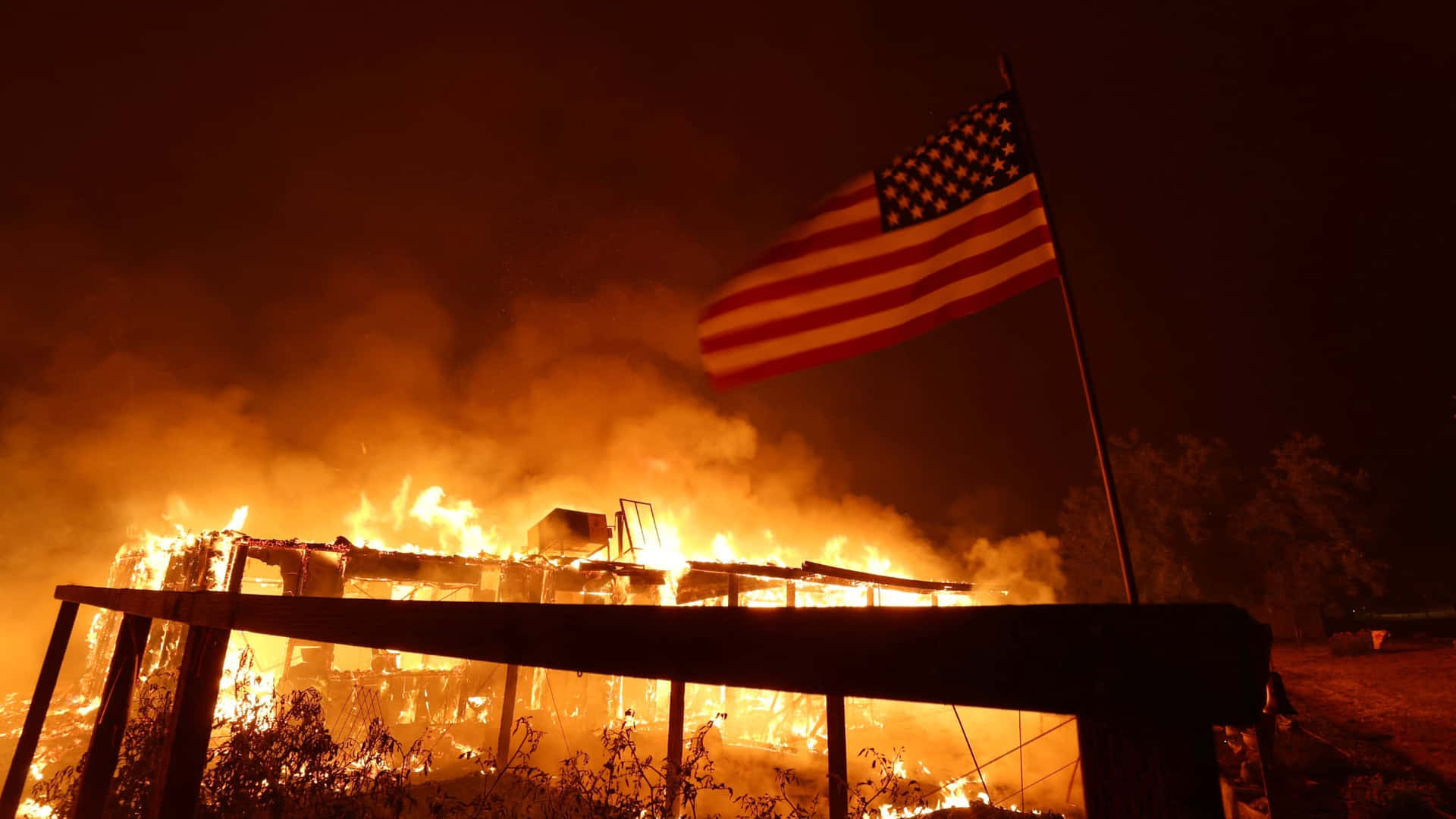 Virulent Fire Destroying The Building Background