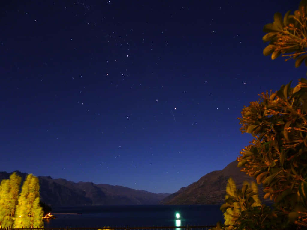 Visible Stars Over Mountains Background