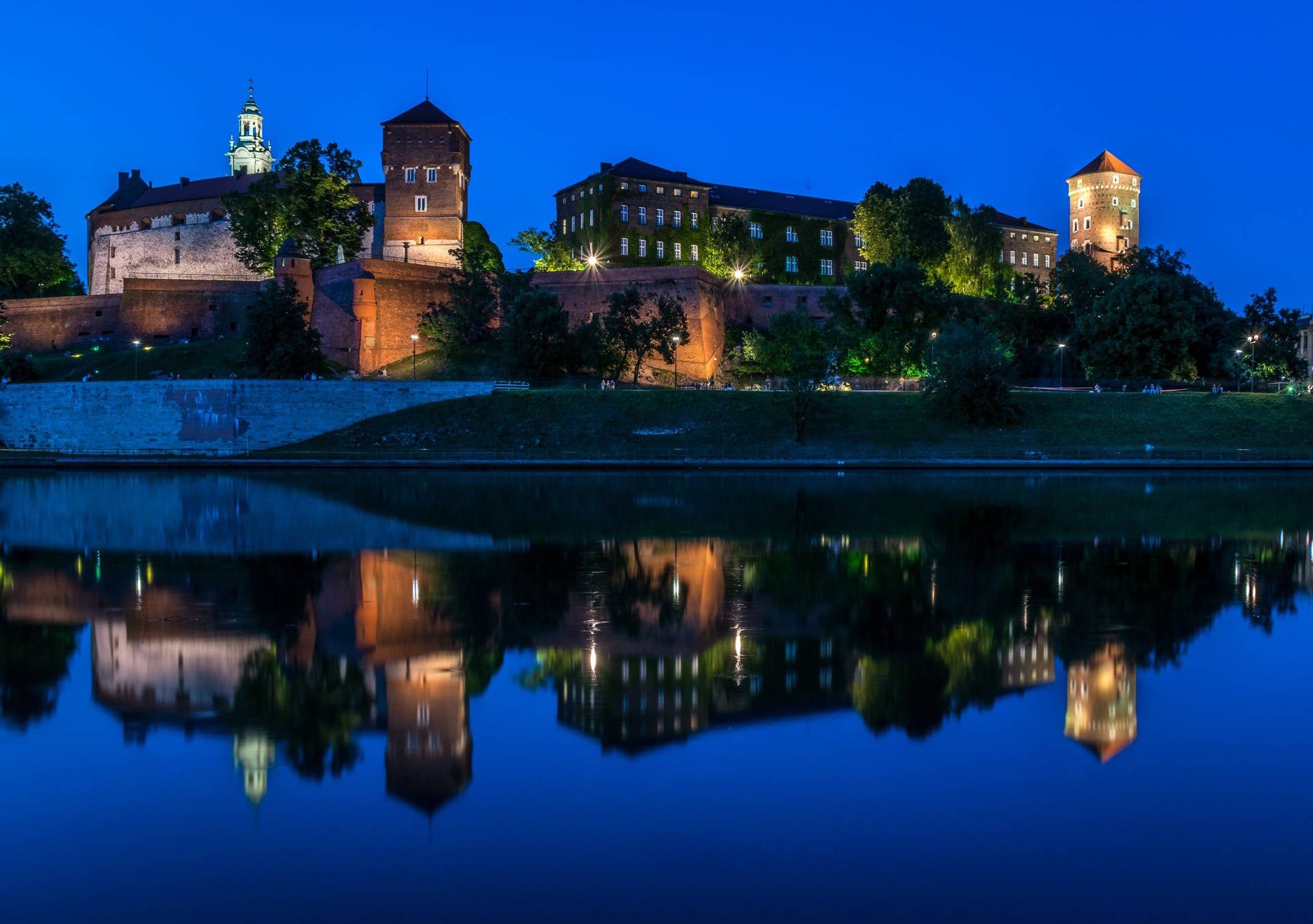 Vistula River In Krakow Poland At Night Background