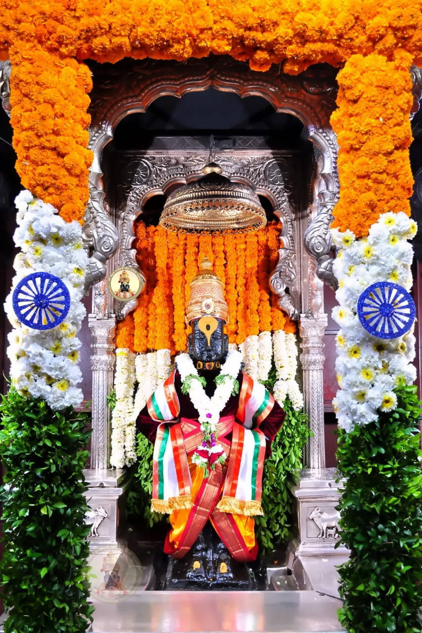 Vitthal With Floral Altar Background