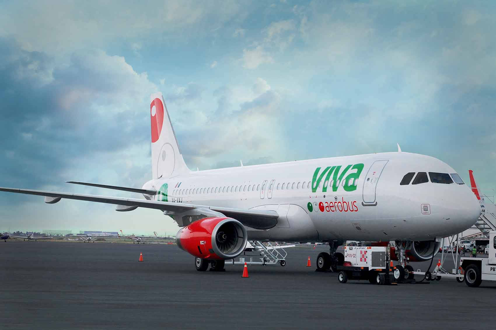 Viva Aerobus Parked Under Sky With Clouds Background