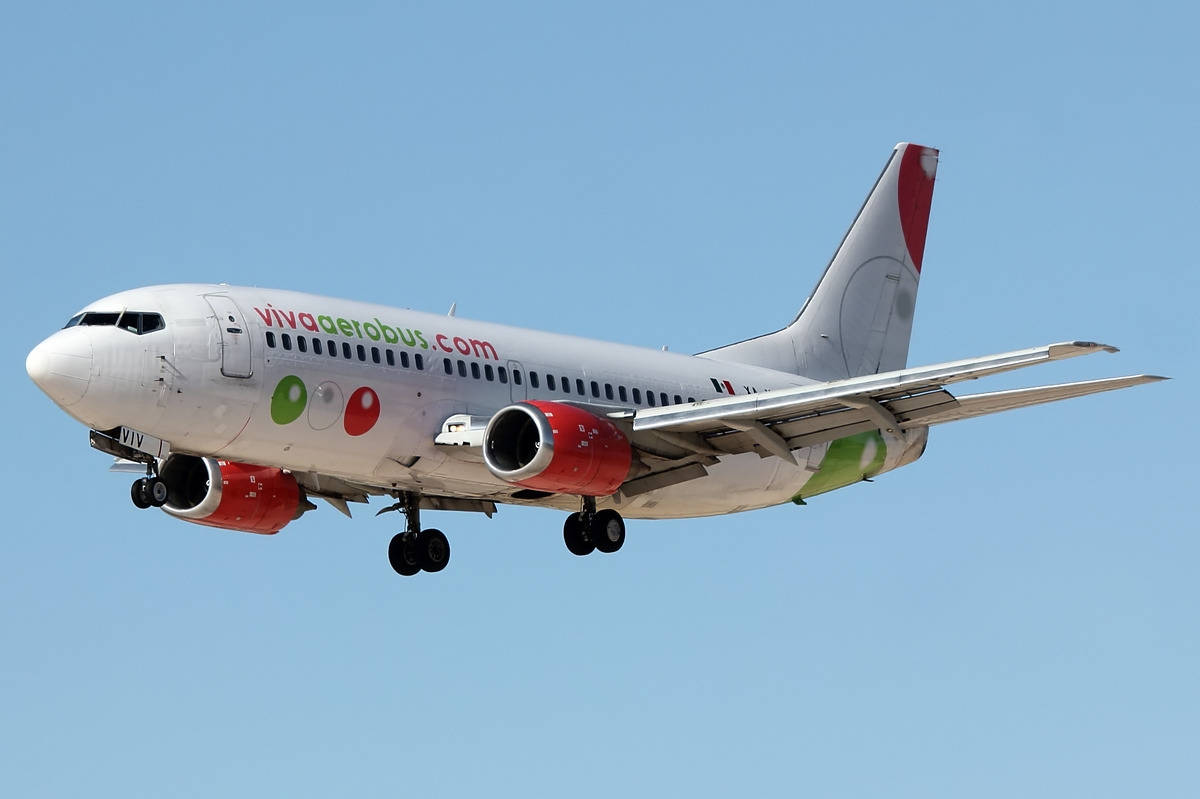 Viva Aerobus Red And Green On Clear Sky Background