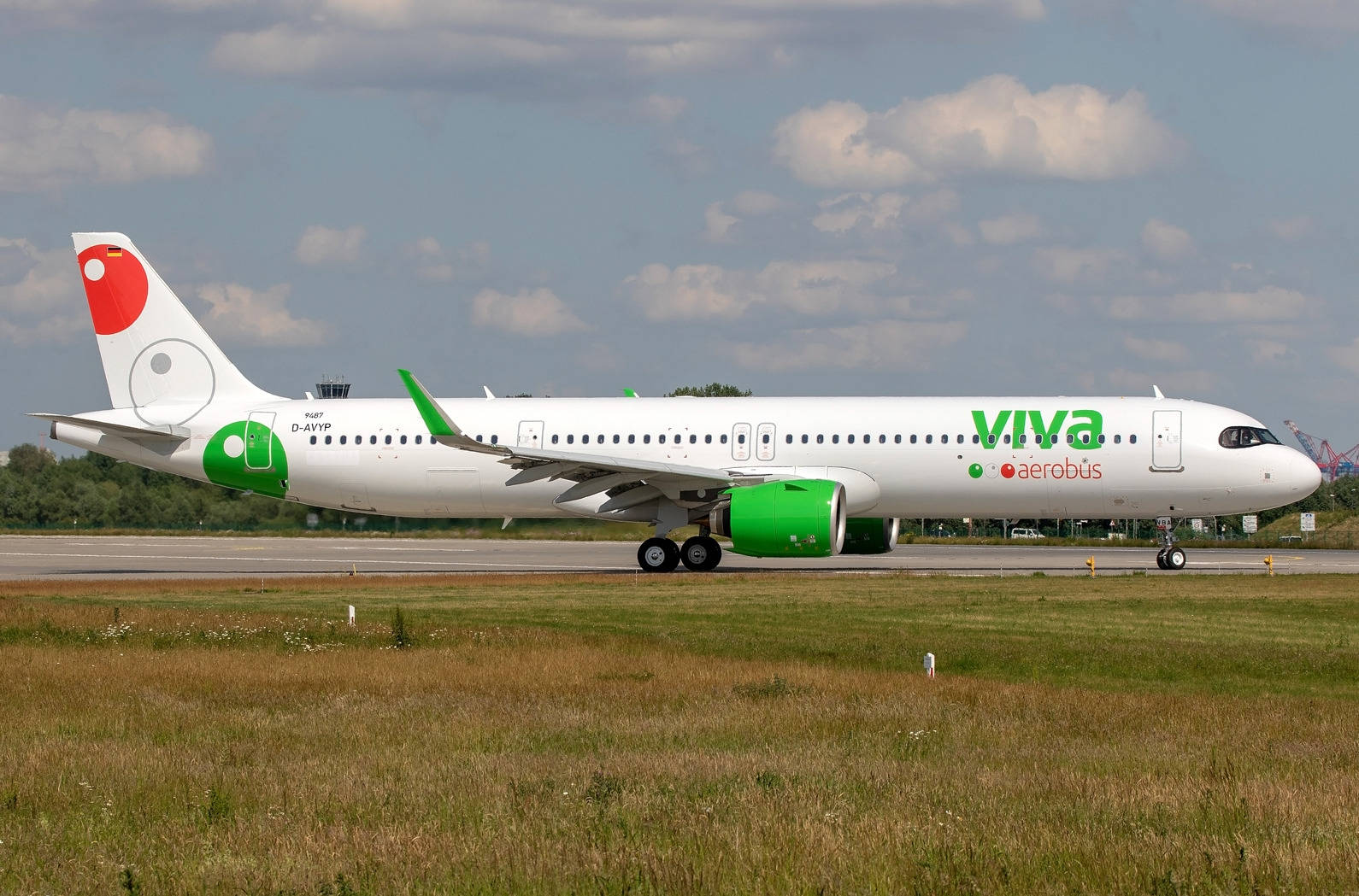 Viva Aerobus Runway With Grass Field Background