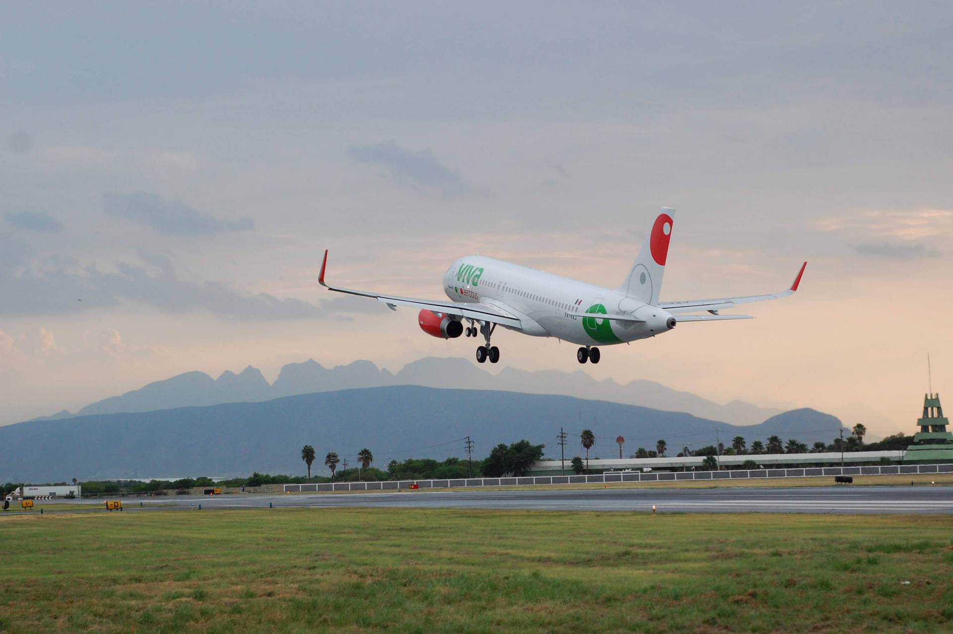 Viva Aerobus Taking Off From Airport Runway Background