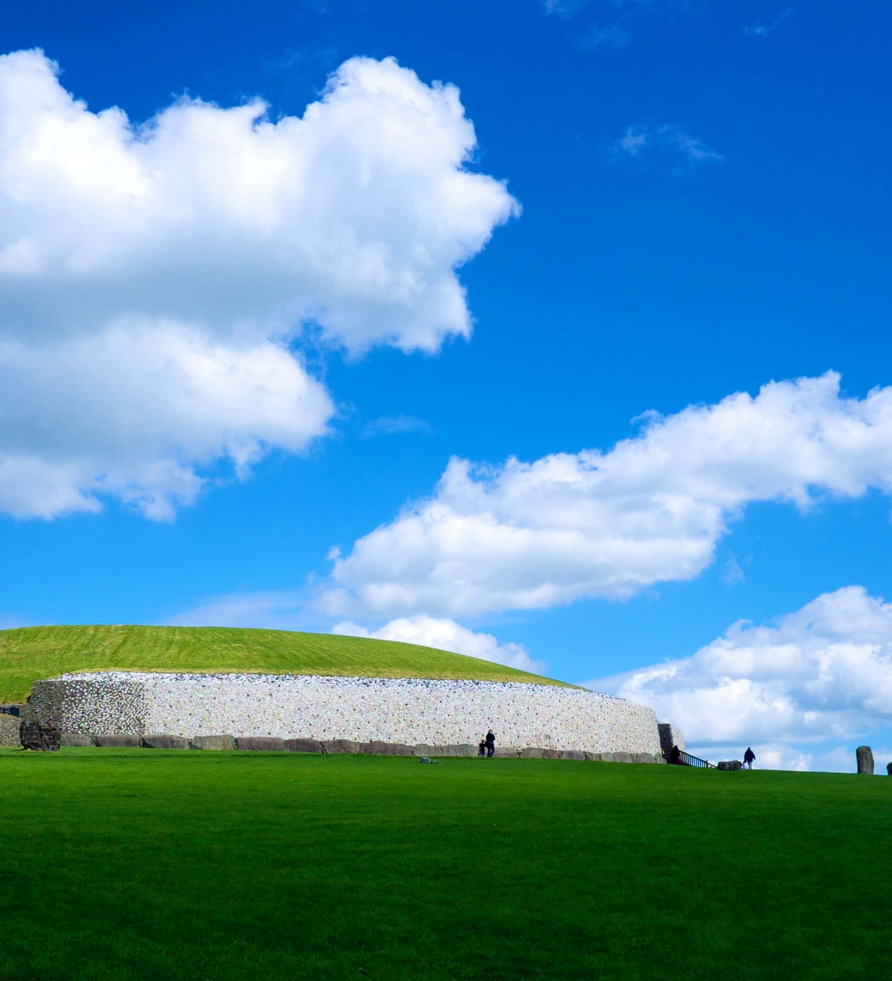Vivid Newgrange With Blue Sky Background