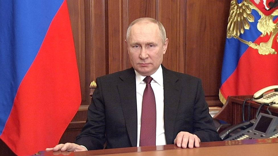 Vladimir Putin Contemplatively Rests Hands On Table