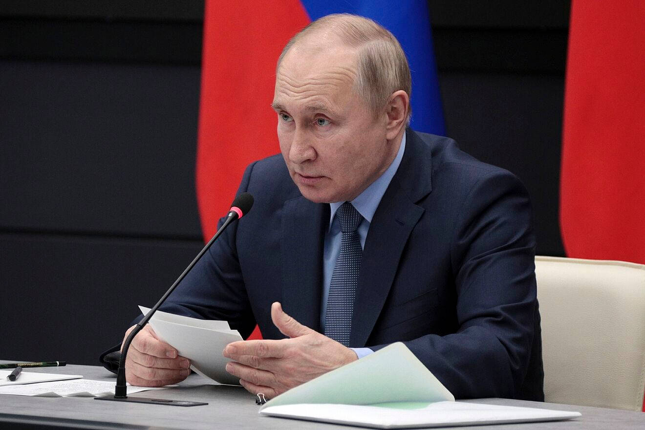 Vladimir Putin Holding Papers During Speech