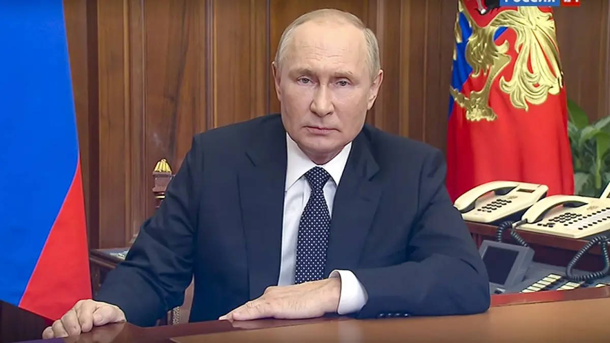 Vladimir Putin In A Thoughtful Pose With His Arm On The Table. Background